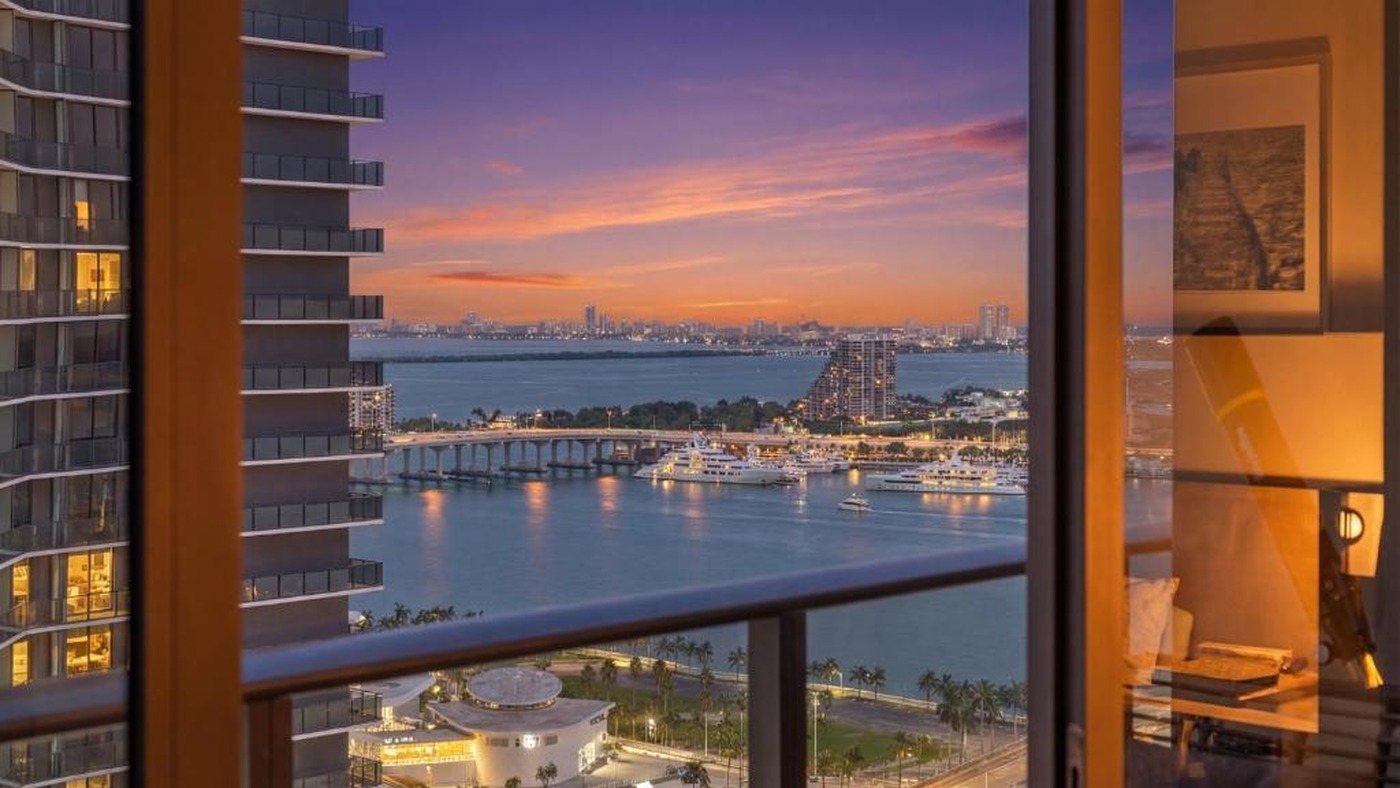 The view over Biscayne Bay from a high Brickell floor at dusk